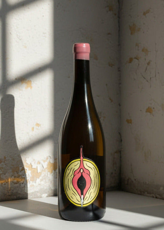 Bottle with a distinctive label on a textured wall background